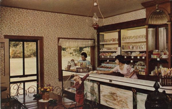Color postcard of the interior of the candy store at Stonefield.
