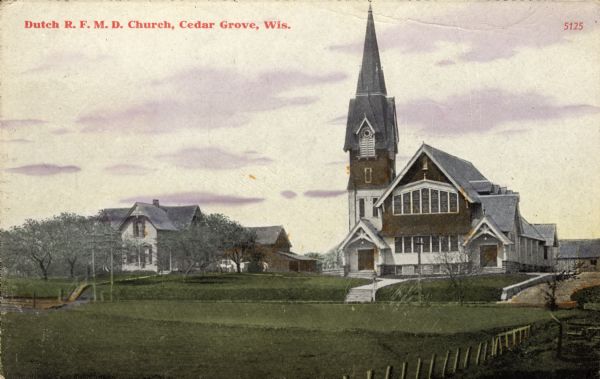Hand-colored view of the Dutch R.F.M.D. Church. View across field or lawn. There is a dwelling and stable to the left of the church, and another building is behind the church. Caption reads: "Dutch R.F.M.D. Church, Cedar Grove, Wis."