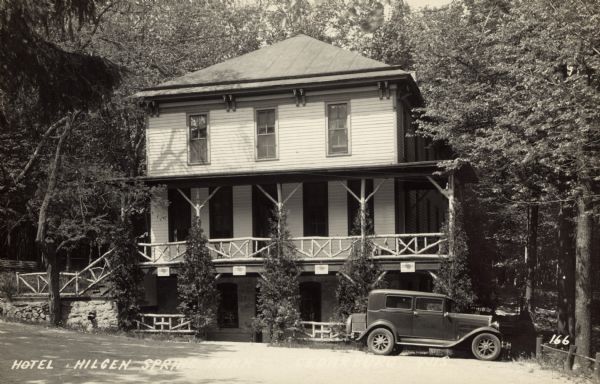 Photographic postcard view of the Hotel Hilgen Spring with an automobile parked in front. Caption reads: "Hotel Hilgen Spring, Cedarburg, Wis."