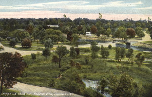 A colored photographic elevated view of Irvine Park. There are park roads, a bridge and trees. Caption reads: "Chippewa Falls, Wis. General View, Irvine Park."