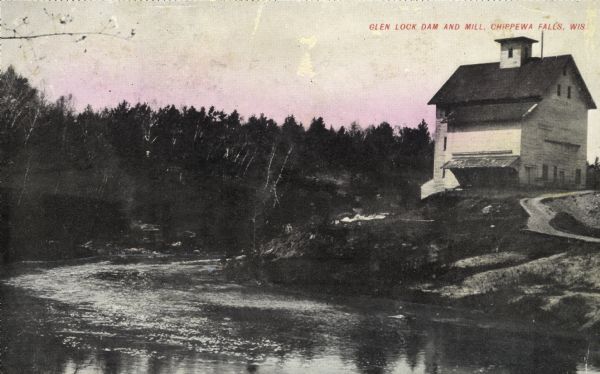 View across river toward the mill and dam. Caption reads: "Glen Lock Dam and Mill, Chippewa Falls, Wis."
