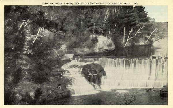 Elevated view from shoreline of Glen Loch in Irvine Park. Caption reads: "Dam at Glen Loch, Irvine Park, Chippewa Falls, Wis."