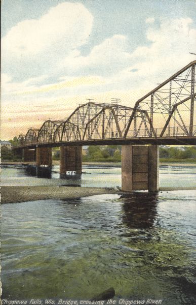 A colorized view from shoreline of the steel beam bridge, with five sections and five bridge pylons. The bridge was downstream from the rapids on Main street. Caption reads: Chippewa Falls, Wis. Bridge crossing the Chippewa River."