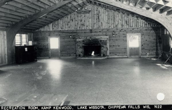 Photographic postcard view of the recreation room at Kamp Kenwood on Lake Wissota. Caption reads: "Recreation Room Kamp Kenwood on Lake Wissota, Chippewa Falls, Wis."