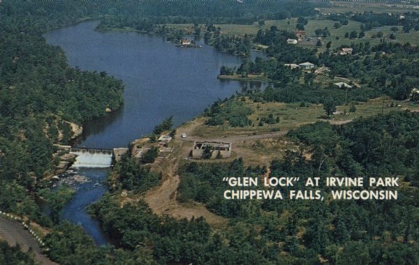 Color postcard aerial view. Caption reads: "'Glen Lock' at Irvine Park, Chippewa Falls, Wisconsin." Caption on back reads: "This view from Irvine Park shows 'Glen Lock' Dam with Dunkin Creek waters starting their flow through beautiful Irvine Park."
