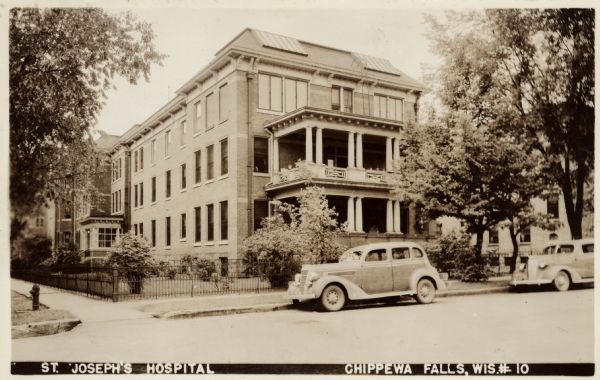 Photographic postcard view from street of St. Joseph's Hospital. Caption reads: "St. Joseph's Hospital, Chippewa Falls, Wis."