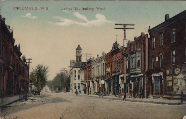 Hand-colored photograph of James Street looking west. Caption reads: "Columbus, Wis., James St., Looking West."