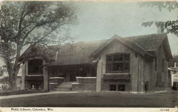 Exterior view of the entrance to the public library. Caption reads: "Public Library, Columbus, Wis."