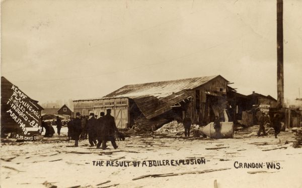 Photographic postcard showing the results of a boiler explosion at the Kempf Planing Mill. Written on the left is text that reads: "Kempf Planing Mill, 3 Killed, 1 Injured - 8 A.M. Mar. 17, 1908." Caption reads: "The Result of a Boiler Explosion, Crandon, Wis."