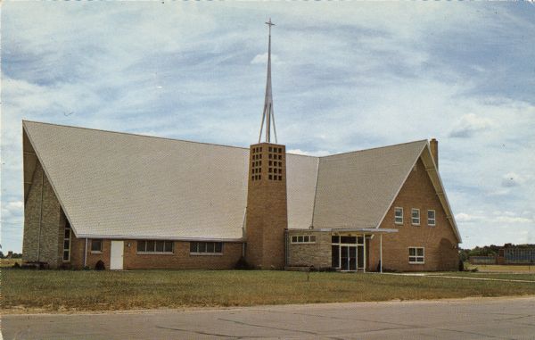 First Lutheran Church, Elm and 8th Avenue. Text on back reads: "Congregation organized 1882. Church was dedicated April 21st, 1963. Affiliated with the American Lutheran Church."