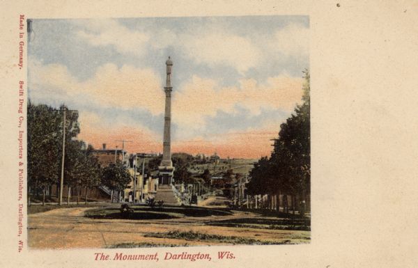 View down hill toward the Soldier's Monument. Caption reads: "The Monument, Darlington, Wis."
