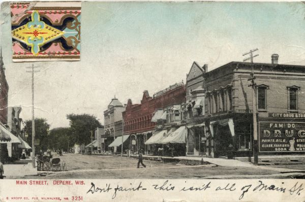 View towards intersection and the business district on Main Street. There is a horse and buggy on the left, and a few pedestrians. Caption reads: "Main Street, Depere[sic], Wis."