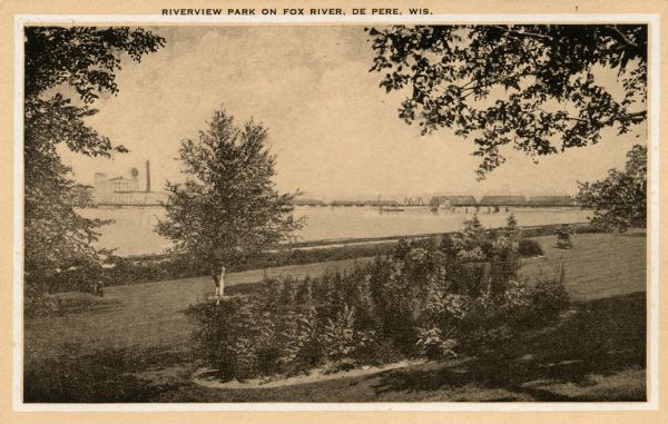 Riverview Park on Fox River, with trees and shrubs. Caption reads: "Riverview Park on Fox River, De Pere, Wis."