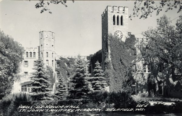 Black and white photographic postcard of Wells-DeKoven Hall. Caption reads: "Wells-DeKoven Hall, St. John's Military Academy, Delafield, Wis."