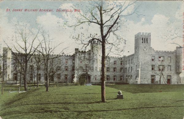 Colored postcard view of a large building and grounds at St. John's Military Academy. Caption reads: "St. John's Military Academy, Delafield, Wis."