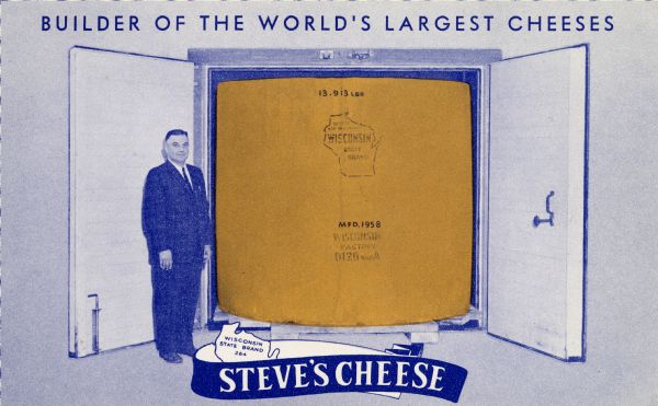 Steve Siudzinski, owner of Steve's Cheese, standing in front of a vault that is holding a block of cheddar cheese weighing 13,913 lbs, and marked MFD. 1958.