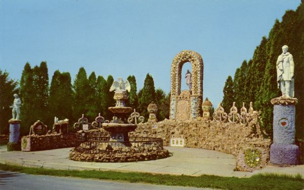 View of the Patriotic Shrine on the grounds of the Dickeyville Grotto. The shrine, which was created by Father Matthias Wernerus in 1929-30, honors Columbus, Washington and Lincoln. In the center of the shrine is a fountain with a sculpture of an eagle on the top.