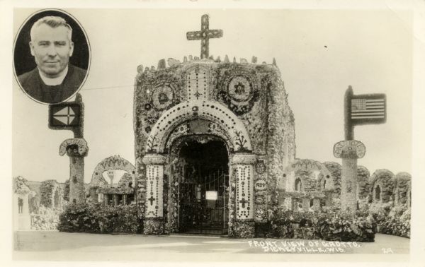 A black and white photographic postcard view of the front of the Dickeyville Grotto. In the top left corner of the postcard is a small oval portrait of Father Mathias Wernerus, the Catholic priest who constructed the grotto and shrines on grounds near the Holy Ghost Church between 1920 and 1930.