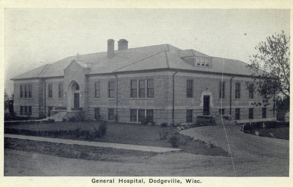 Slightly elevated photographic postcard view of the General Hospital. Caption reads: "General Hospital, Dodgeville, Wisc."