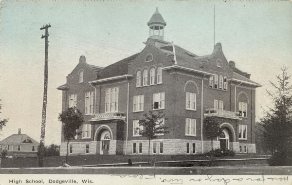 View from street of the high school building. Caption reads: "High School, Dodgeville, Wis."