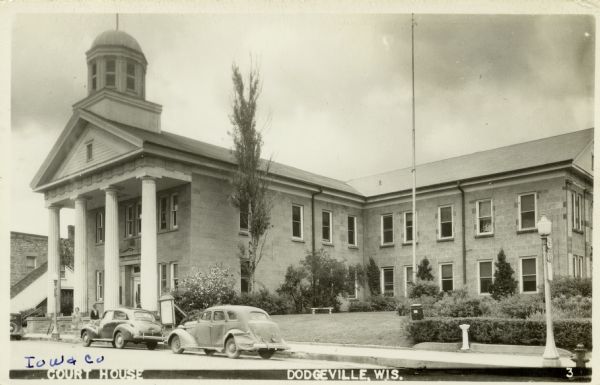 View from street towards the Iowa County Court House. Built in 1857, it is the oldest operating court house in Wisconsin. Caption reads: [Iowa County] Court House, Dodgeville, Wis."