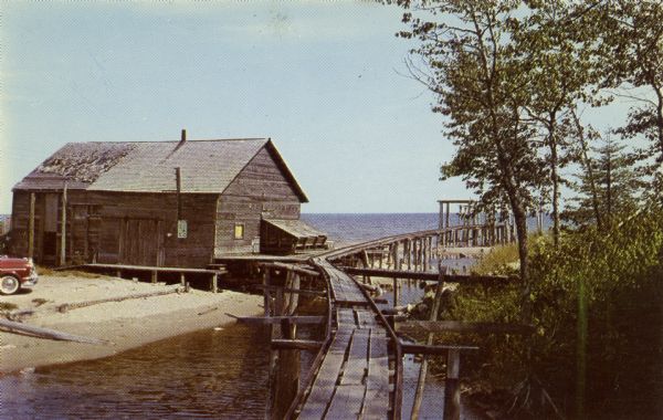 View towards a fishing dock on an outlet along the shoreline of Lake Michigan.