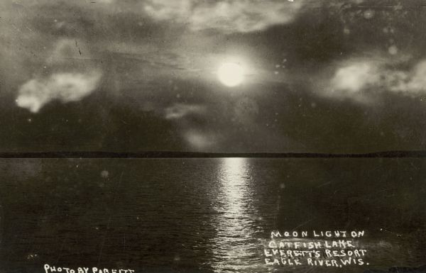 Moonlight over Everett's Resort on Catfish Lake, east of Eagle River off of STH 70. Caption reads: "Moonlight Over Everett's Resort on Catfish Lake, Eagle River, Wis."