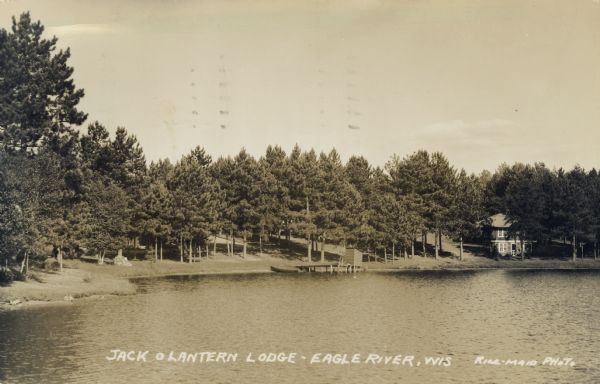 View across water towards Jack O'Lantern Lodge located on Taylor Lake, east of Eagle Lake on STH 70. Caption reads: "Jack O'Lantern Lodge, Eagle River, Wis."