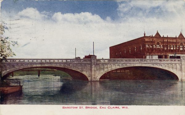 View of the Barstow Street Bridge in downtown Eau Claire. Caption reads: "Barstow Street Bridge, Eau Claire, Wis."
