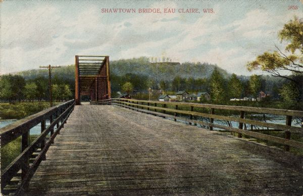 View looking down the Shawtown Bridge. Caption reads: "Shawtown Bridge, Eau Claire, Wis."