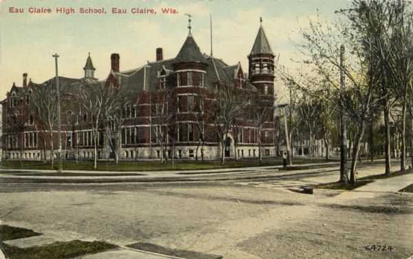 Eau Claire High School building at the intersection of two streets. Ornate brick and stone building with turrets and spires. Caption reads: "Eau Claire High School, Eau Claire, Wis."