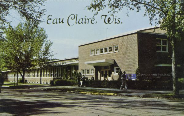 Photographic postcard view from street towards the Wisconsin State College in Eau Claire. Students are on the sidewalk. Caption reads: "Eau Claire, Wis."