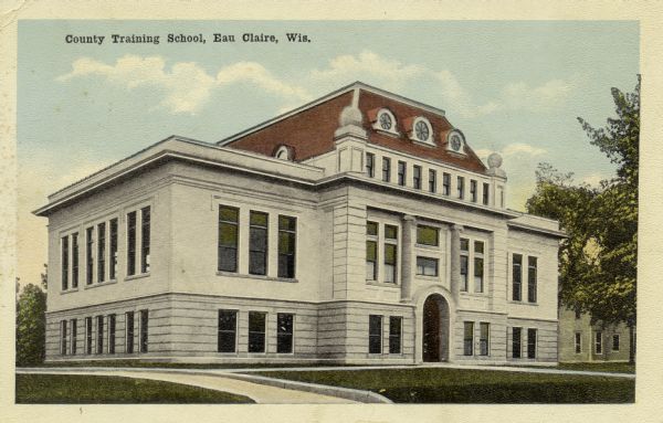View from street towards the County Training School. Caption reads: "County Training School, Eau Claire, Wis."