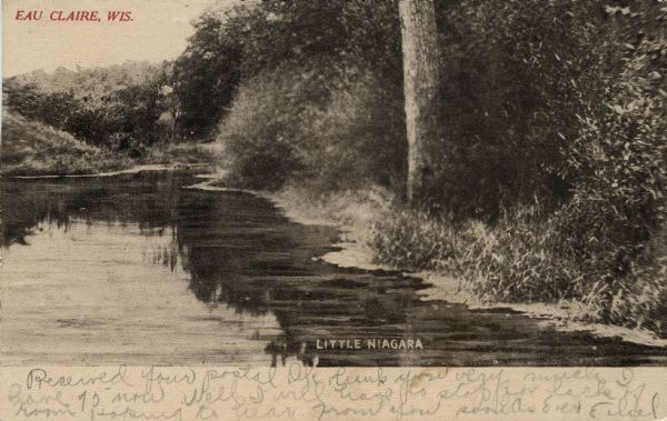 Black and white photographic postcard view of the Little Niagara River and wooded shoreline. Caption reads: "Eau Claire, Wis." at the top, and at the bottom: "Little Niagara."