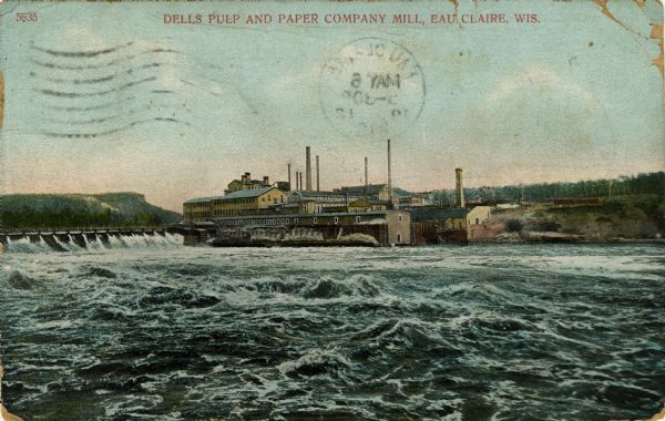 Colorized photograph of the Dells Pulp and Paper Company mill on the Eau Claire River. Caption reads: "Dells Pulp and Paper Company Mill, Eau Claire, Wis."