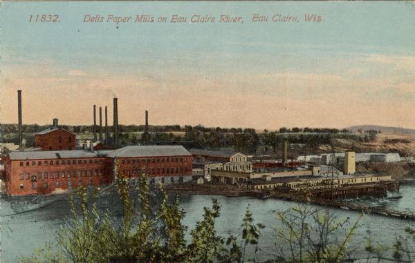 Colorized elevated view of the Dells Paper Mills on the Eau Claire River. Caption reads: "Dells Paper Mills on Eau Claire River, Eau Claire, Wis."
