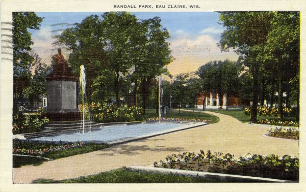 Colorized photographic postcard view of Randall Park, with fountain and statue. Caption reads: "Randall Park, Eau Claire, Wis."