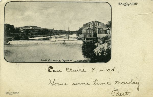 In the foreground is a dam with the river cascading over it. On the right side of the dam is a mill consisting of four closely spaced buildings. "Eau Claire Linen Co" is printed at the peak of the tallest building. Near it is a lattice deck bridge diagonally crossing the river. Caption reads: "Eau Claire River, Eau Claire, Wis."