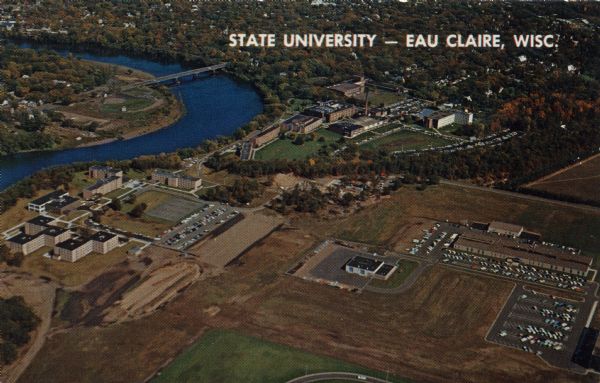 Aerial view of the State University adjacent to the Chippewa River. Caption reads: "State University - Eau Claire, Eau Claire, Wis."