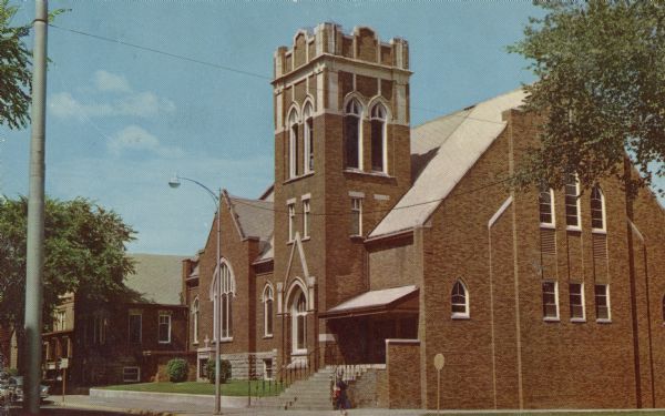 Color photographic postcard of Grace Lutheran Church. Text on reverse reads: "Grace Lutheran Church on Eau Claire, Wisconsin's Grand and Second Avenue on the West Side, one block west of the Grand Avenue Bridge. This one of the biggest churches in the area."