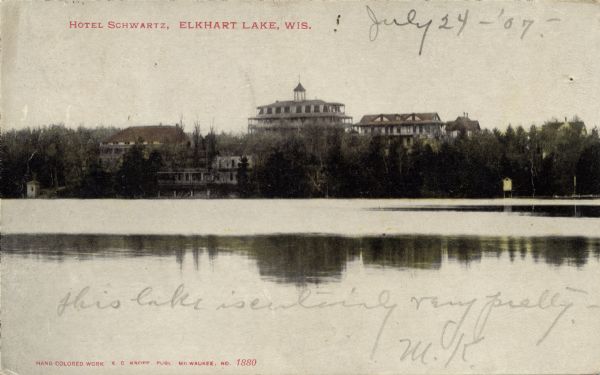 Colorized view of Hotel Schwartz from across Elkhart Lake. Caption reads: "Hotel Schwartz, Elkhart Lake, Wis."