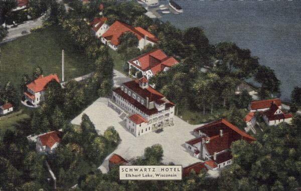 Colorized aerial view of the Schwartz Hotel on the shores of Elkhart Lake, with several white buildings with red roofs. Caption reads: "Schwartz Hotel, Elkhart Lake, Wisconsin."

Text on reverse reads: "The Modern Schwartz Hotel
Golfing, Bathing, Boating, Riding, Hiking, Tennis
150 Rooms -- 75 with Bath
Famous for its food
Wisconsin's Leading Summer Resort"