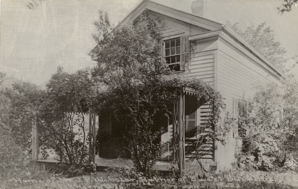 Photographic postcard view of the J.P. Webster home. Caption reads: "Home of J.P. Webster, author of "Sweet Bye-Bye, Elkhorn, Wis."