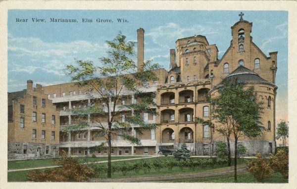 Colorized view of the back of the Marianum Convent. An automobile is parked in the drive. Caption reads: "Rear View, Marianum, Elm Grove, Wis."