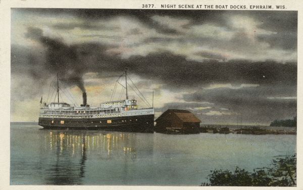 Twilight view of a steamer at the Ephraim dock. Caption reads: "Night Scene at the Boat Docks, Ephraim, Wis."