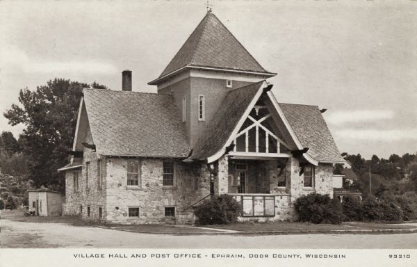 View of the stone building that houses the city hall and post office. Caption reads: "Village Hall and Post Office - Ephraim, Door County, Wis."