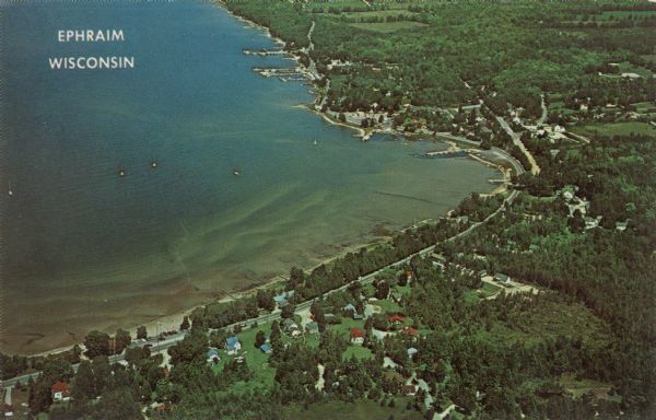 Aerial view of Ephraim and Eagle Bay. A two-lane highway runs along the coastline. Caption reads: "Ephraim, Wisconsin."