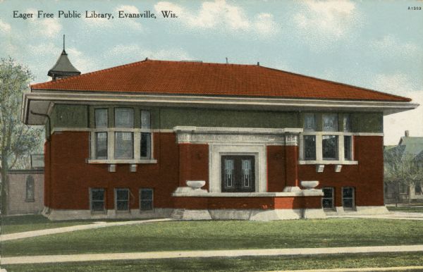Hand-colored view of the public library, a red brick building with bay windows flanking the entrance. Caption reads: "Eager Free Public Library, Evansville, Wis."