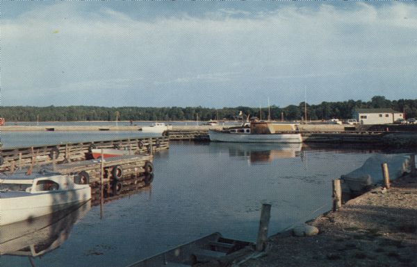 Color photographic postcard view of the Fish Creek Marina.