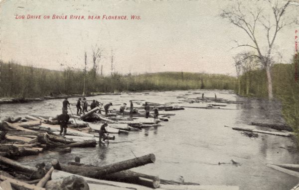 A group of men driving logs down the Brule. Caption reads: "Log Drive on Brule River, Near Florence, Wis."
